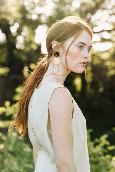 model wearing Jola Earrings by Anukah Jewelry, tortoise acrylic print, acrylic and metal earrings